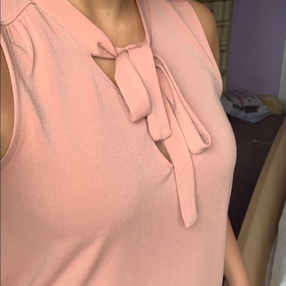 Pink top with bow, perfect for work